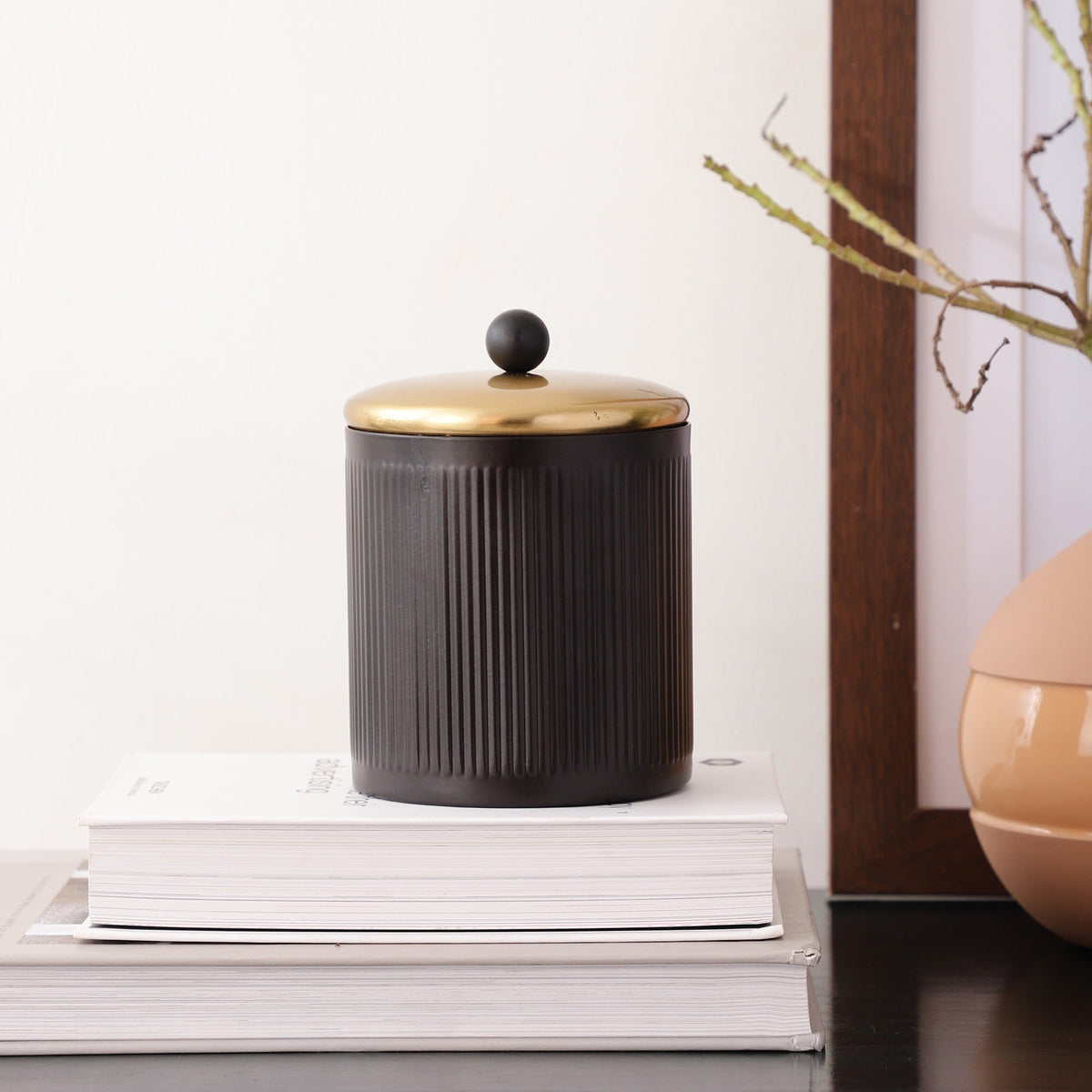 Luxora cylindrical box in Black M.M.I. OVERSEAS