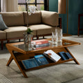 Features a tempered glass top that provides a sturdy surface for drinks or decor Includes a lower shelf that offers convenient storage for reading materials