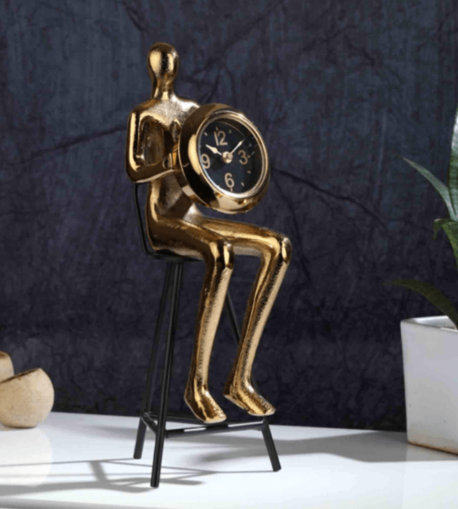 Sitting Man Clock In Gold,